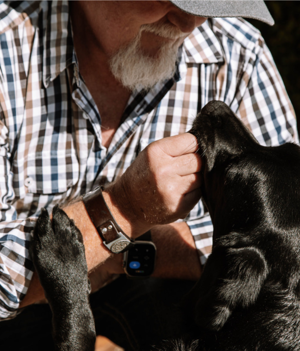 Handler with his Integra Service dog providing comfort looking into each others eyes