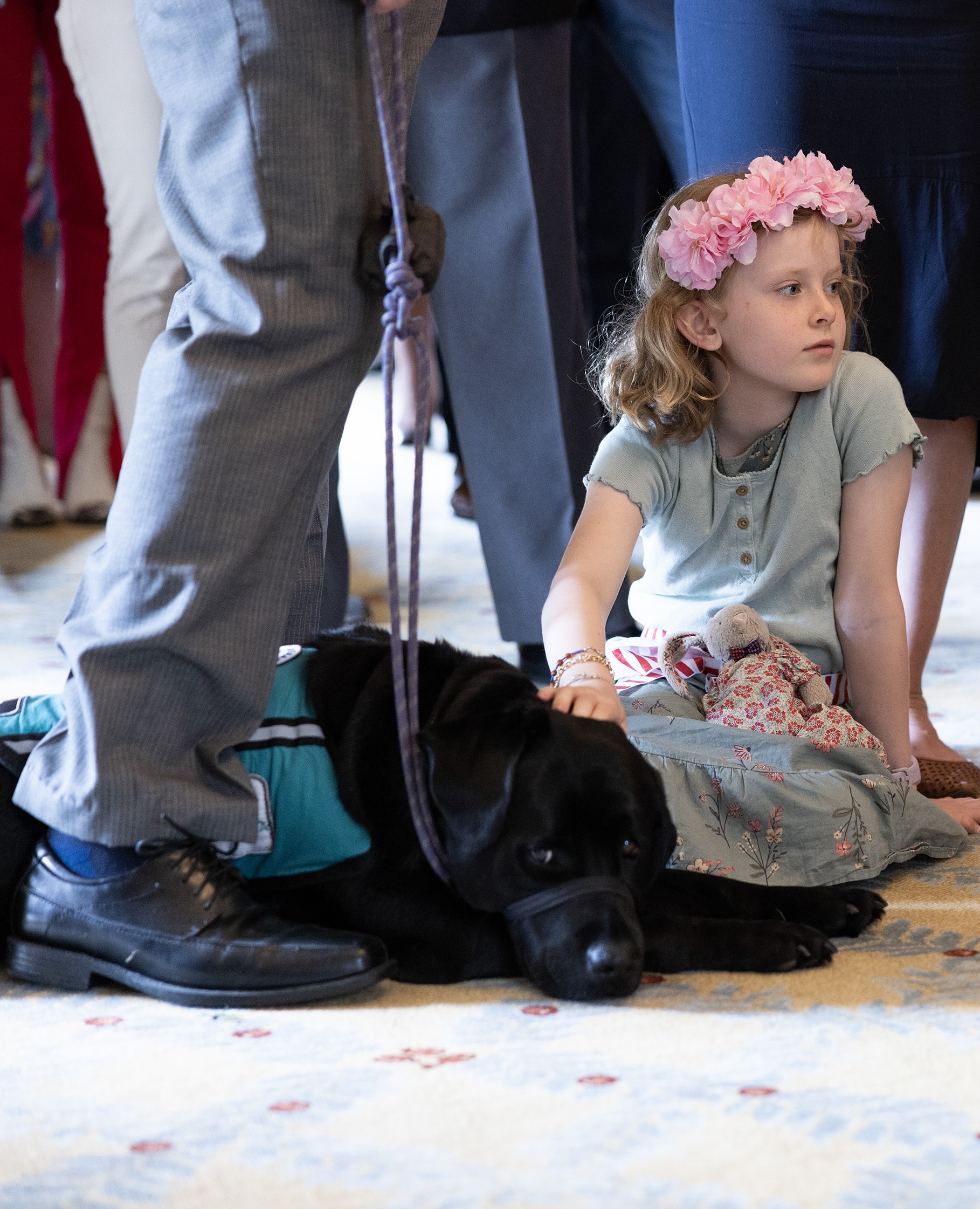 Father and daughter with their Integra Service Dog at function